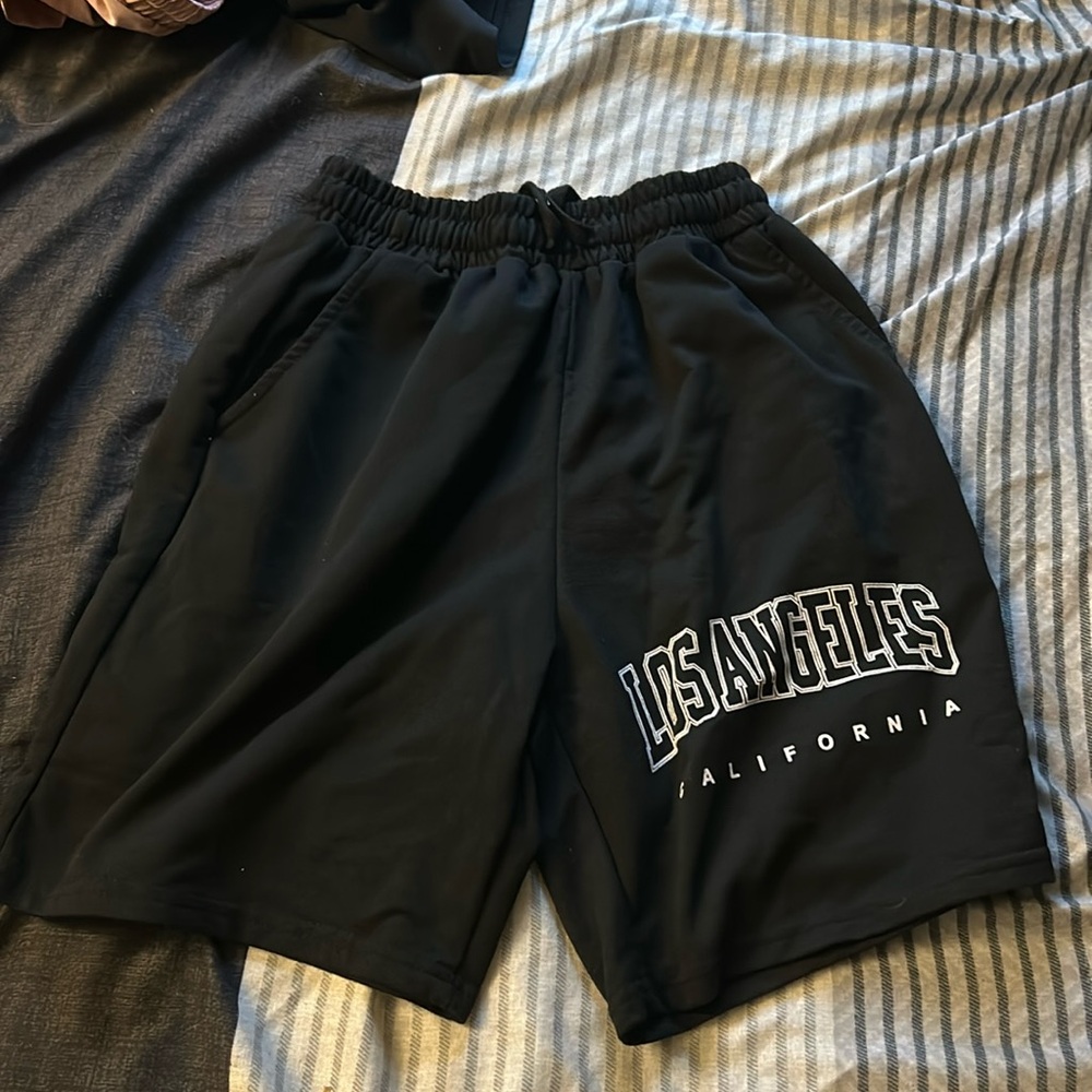 Size small shorts. SHEIN. Black and white. Fits true to size.